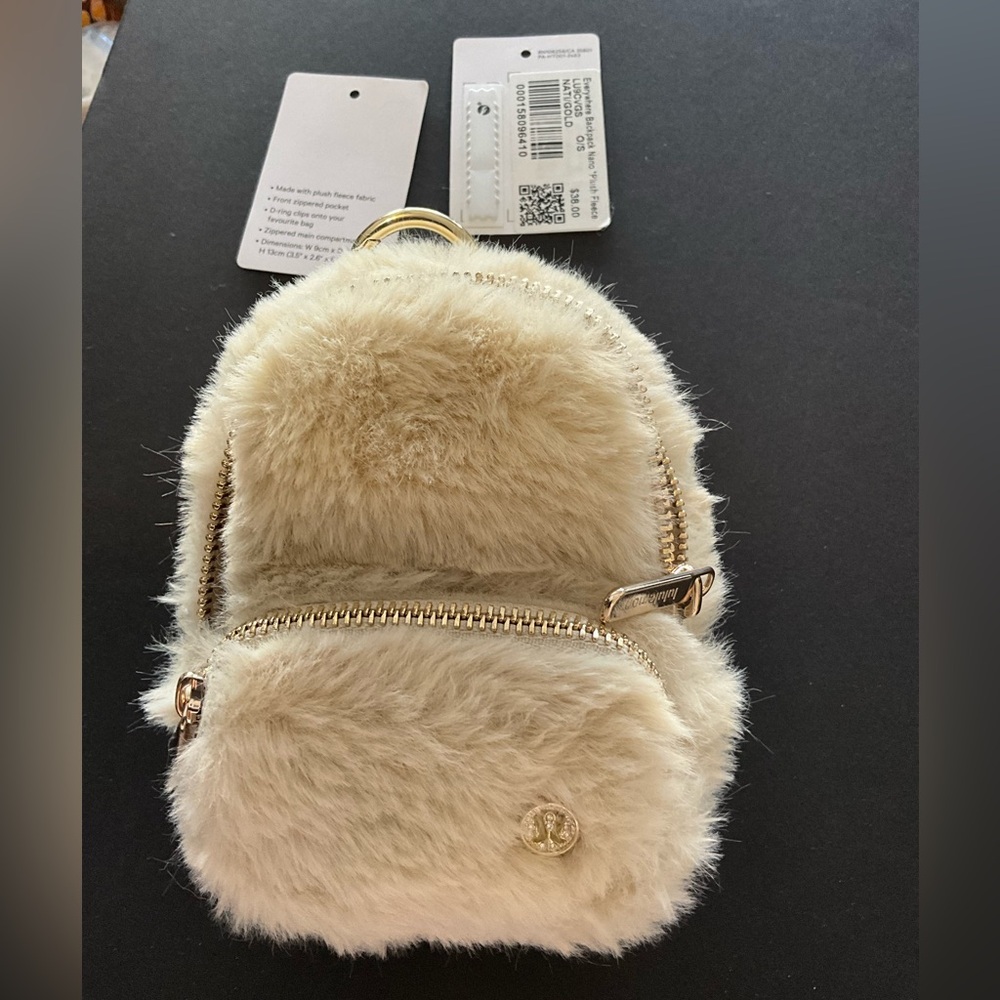 SOLD OUT color Lululemon cream nano backpack plush w gold accents crystal logo✨